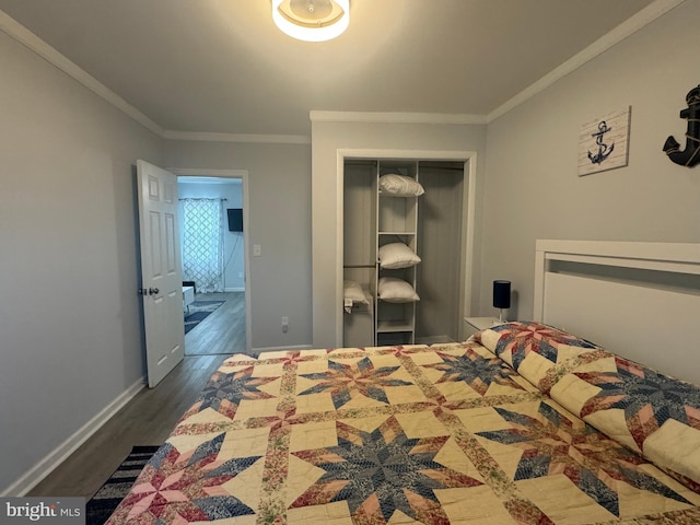 6406 Coastal Hwy Unit 201, Ocean City, MD 21842 - bedroom featuring dark wood-style floors, crown molding, a closet, and baseboards