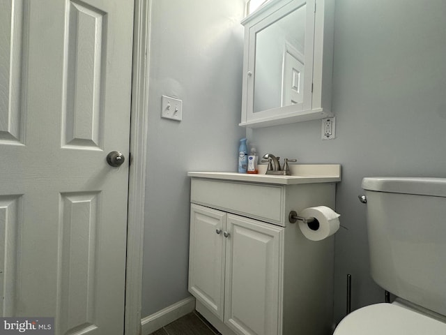 6406 Coastal Hwy Unit 201, Ocean City, MD 21842 - bathroom with toilet, vanity, and baseboards
