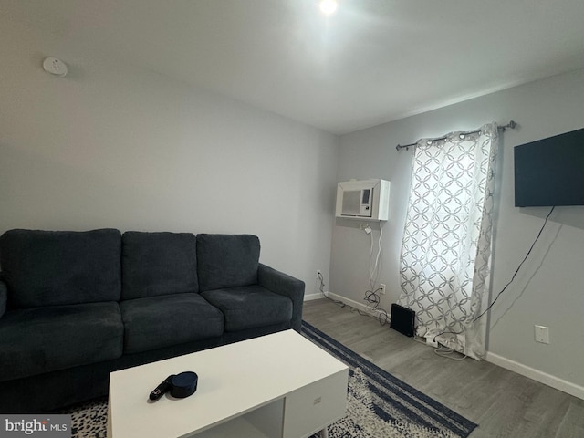 6406 Coastal Hwy Unit 201, Ocean City, MD 21842 - living room featuring wood finished floors, baseboards, and a wall mounted AC