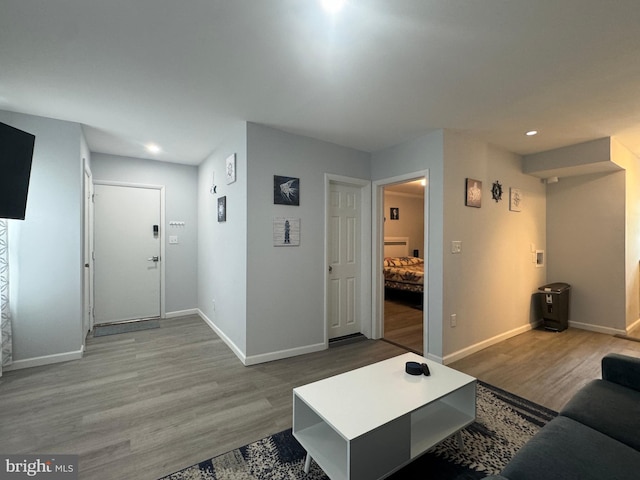 6406 Coastal Hwy Unit 201, Ocean City, MD 21842 - living area featuring wood finished floors, baseboards, and recessed lighting