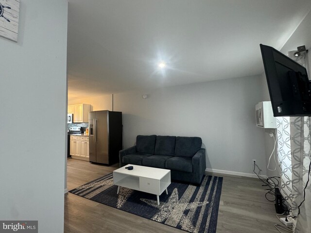 6406 Coastal Hwy Unit 201, Ocean City, MD 21842 - living area featuring light wood-style floors and baseboards