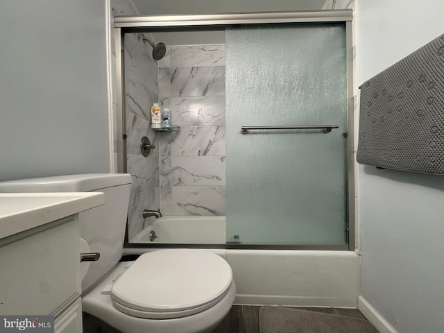 full bathroom with toilet, combined bath / shower with glass door, and vanity