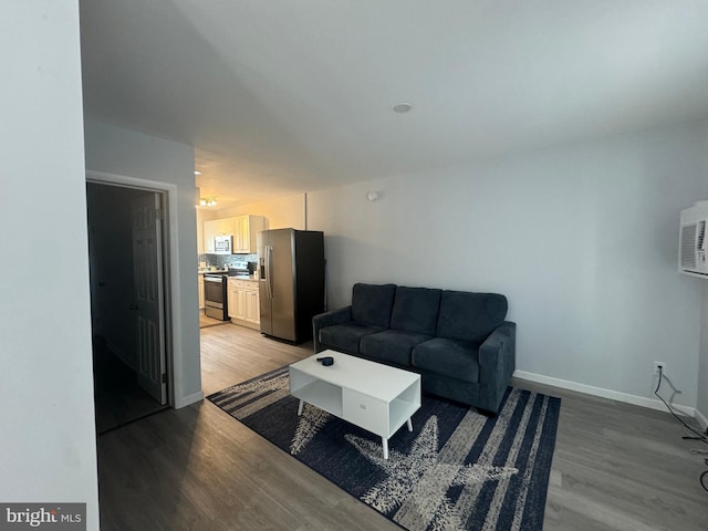 6406 Coastal Hwy Unit 201, Ocean City, MD 21842 - living area featuring light wood finished floors and baseboards