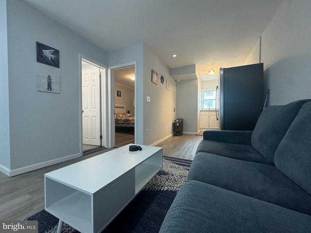 6406 Coastal Hwy Unit 201, Ocean City, MD 21842 - living area with wood finished floors, baseboards, and recessed lighting