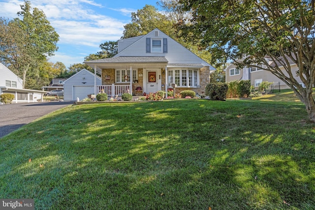 view of front of property featuring covered porch and a front yard