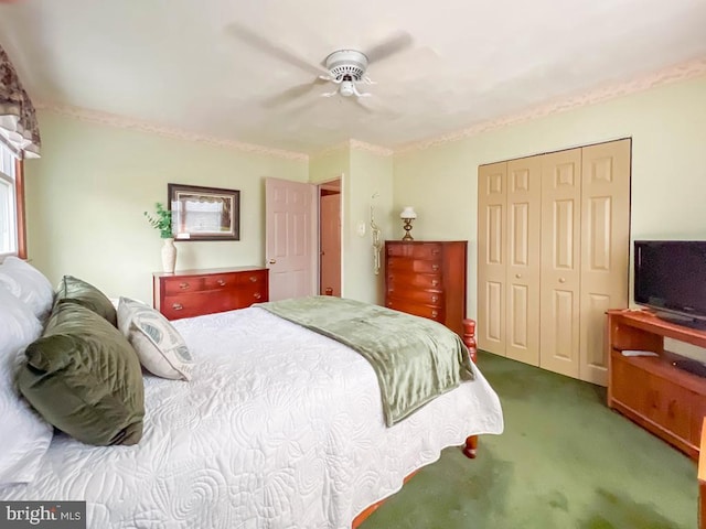 carpeted bedroom with a closet and ceiling fan