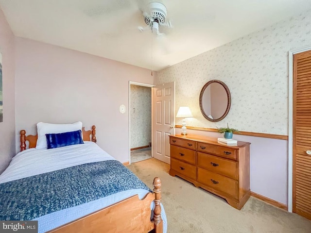 bedroom with ceiling fan and light colored carpet