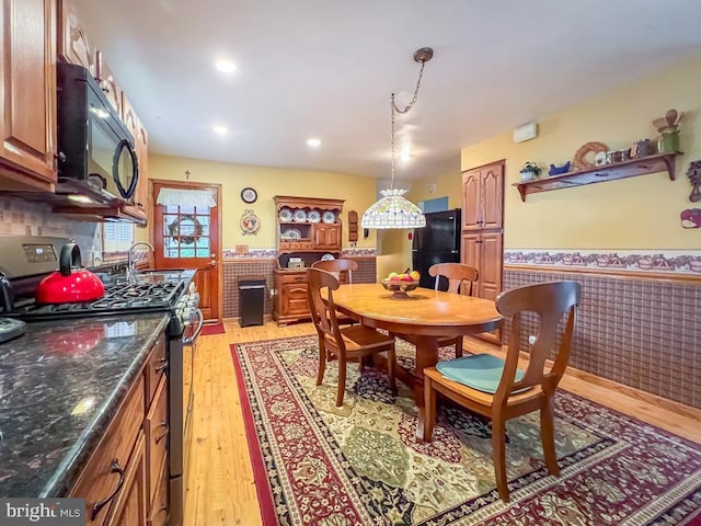 dining space featuring light hardwood / wood-style floors