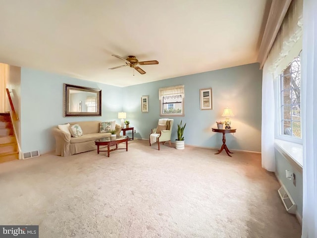 sitting room with carpet flooring and ceiling fan