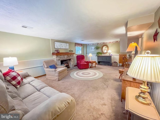 living room featuring a fireplace and carpet flooring