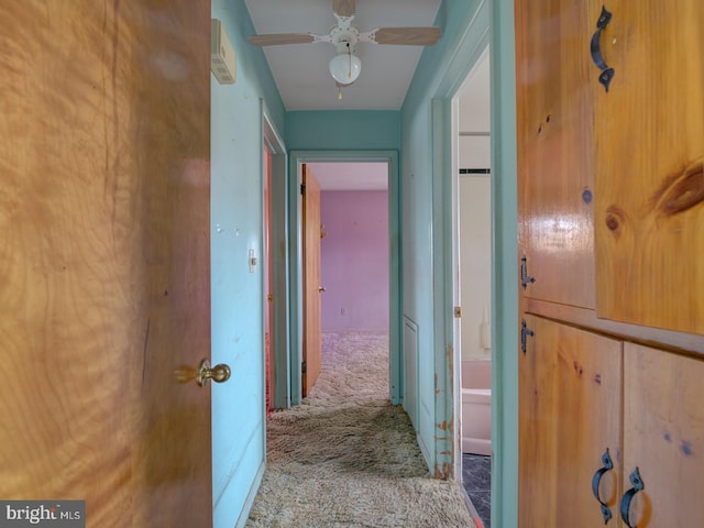 hallway with light colored carpet