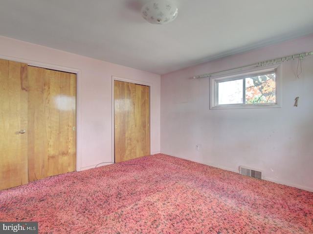 unfurnished bedroom with carpet flooring