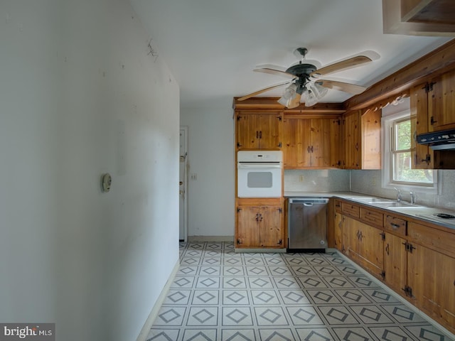 kitchen featuring ceiling fan, sink, tasteful backsplash, range hood, and white appliances