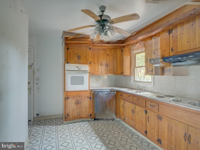 kitchen with white appliances, ventilation hood, sink, ceiling fan, and tasteful backsplash