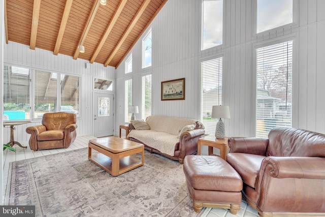 tiled living room with high vaulted ceiling, a wealth of natural light, and wood ceiling