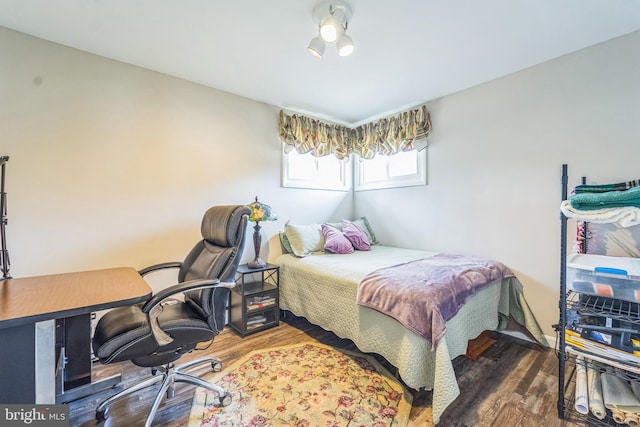 bedroom featuring dark wood-type flooring