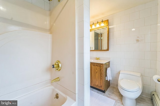 full bathroom with tile patterned flooring, vanity, baseboard heating, and tile walls