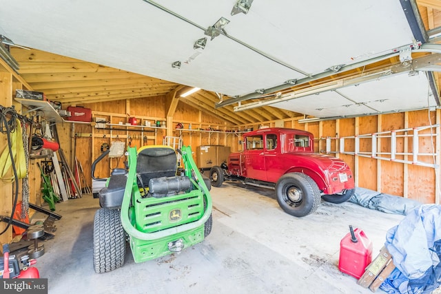 garage featuring wooden walls