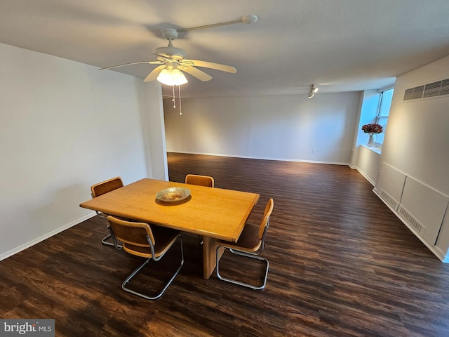 dining room featuring ceiling fan and dark wood-type flooring