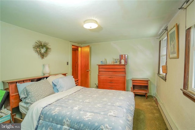 carpeted bedroom with a baseboard radiator