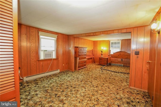 bedroom featuring carpet flooring, a baseboard radiator, multiple windows, and cooling unit