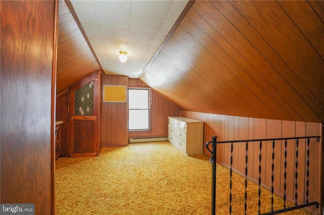 bonus room with light carpet, wooden walls, a baseboard radiator, and lofted ceiling