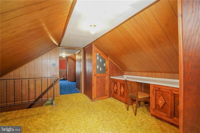 bonus room featuring light carpet, wooden walls, wood ceiling, and vaulted ceiling