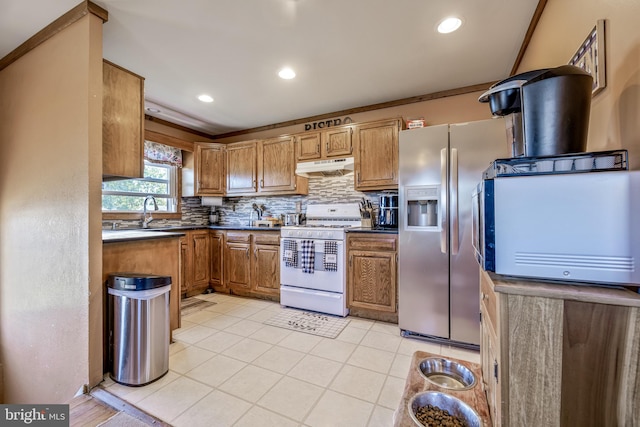 kitchen with backsplash, white stove, sink, stainless steel refrigerator with ice dispenser, and ornamental molding