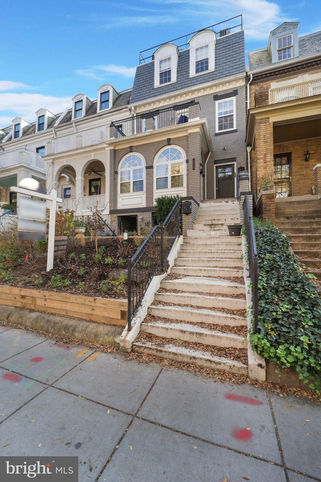 view of property with a balcony