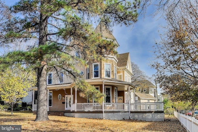 victorian-style house featuring covered porch