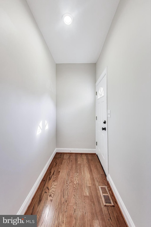 spare room with hardwood / wood-style floors