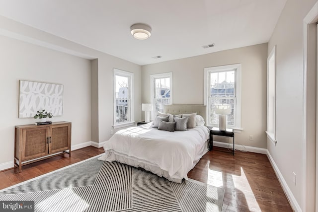 bedroom featuring dark hardwood / wood-style flooring