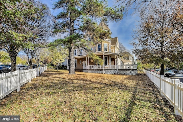 view of yard featuring covered porch