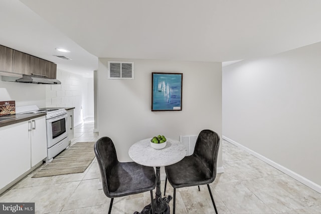 dining room featuring light tile patterned flooring