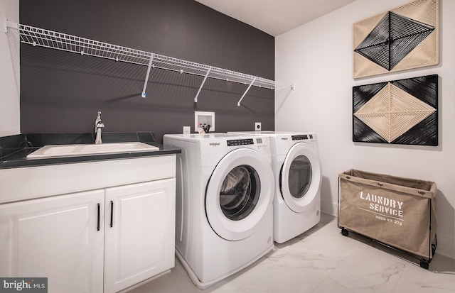 laundry area featuring washer and clothes dryer and sink