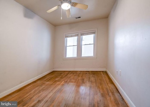 empty room featuring light wood-type flooring and ceiling fan