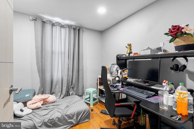 bedroom with hardwood / wood-style floors