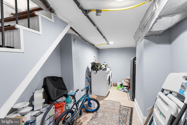 interior space with separate washer and dryer and light hardwood / wood-style floors