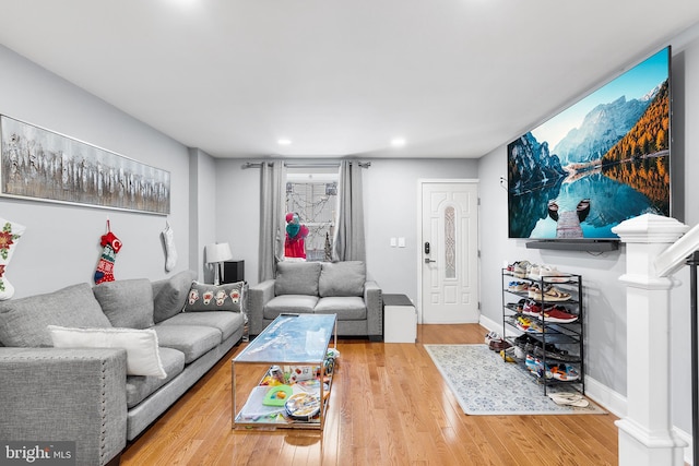 living room with light hardwood / wood-style flooring