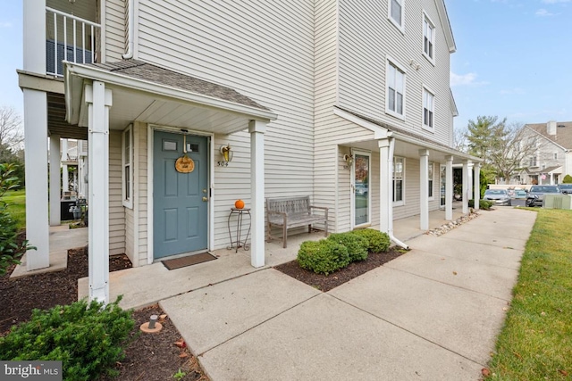 property entrance featuring covered porch