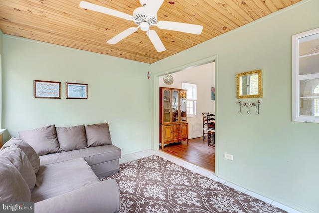 living room with ceiling fan, wooden ceiling, and light wood-type flooring