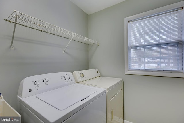 laundry room with plenty of natural light and washing machine and dryer