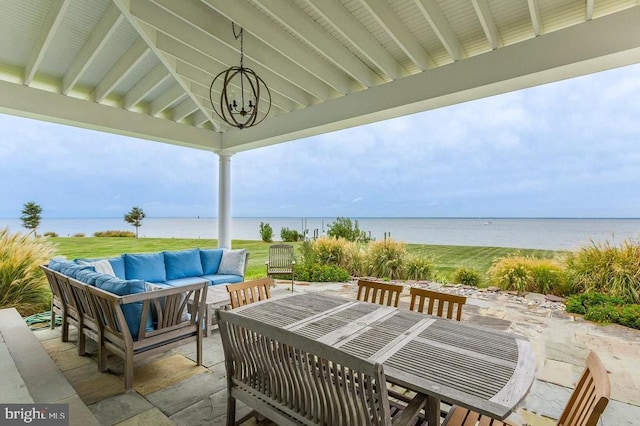 view of patio / terrace featuring a water view and an outdoor hangout area