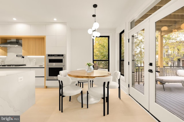 dining area featuring a wealth of natural light and french doors