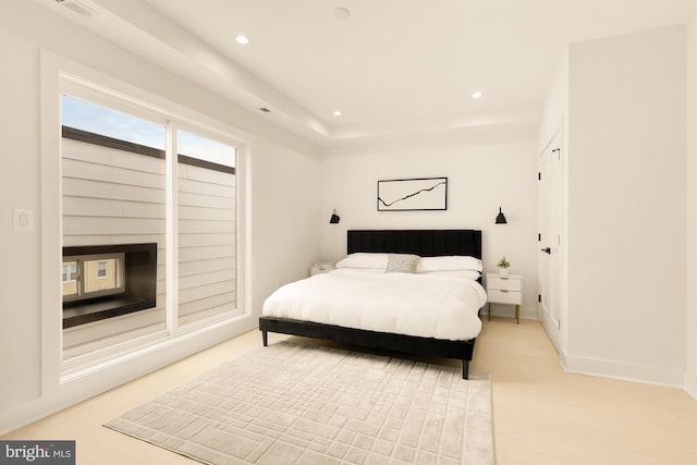 bedroom with light colored carpet