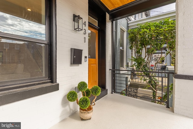 doorway to property featuring covered porch