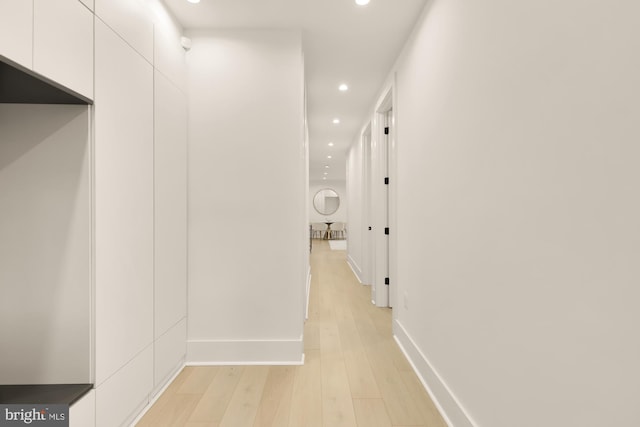 hall with light hardwood / wood-style flooring