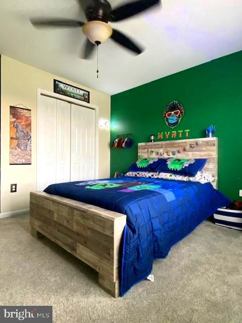 bedroom featuring a closet and ceiling fan