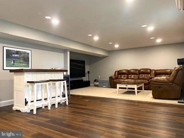 living room with dark hardwood / wood-style flooring