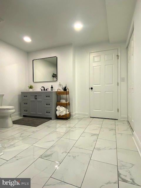 bathroom with vanity and toilet